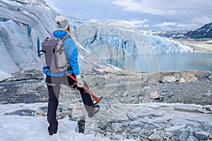 Woman climber standing near Jostedalsbreen glacier.