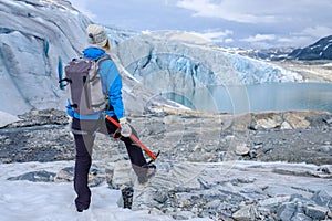 Woman climber standing near Jostedalsbreen glacier. photo