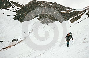 Woman climbing with ice axe mountaineering Travel