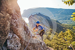 Woman climbing mountain.