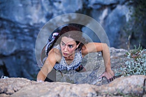 A woman is climbing in Turkey, Overcoming the fear of heights, Climbing effort photo