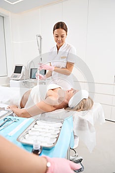 Woman in clinic on procedure laser peeling and CO2 resurfacing