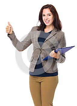 Woman with clipboard and thumb up