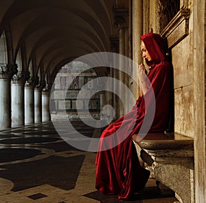 Woman in cloak outdoors