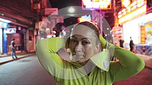 Woman close up look caucasian at Pattaya Walking Street with wearing protective medical mask. Lockdown quarantine