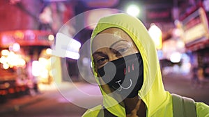 Woman close up look caucasian at Pattaya Walking Street with wearing protective medical mask. Lockdown quarantine