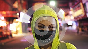 Woman close up look caucasian at Pattaya Walking Street with wearing protective medical mask. Lockdown quarantine
