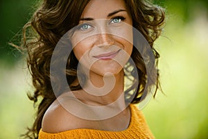 Woman close-up in orange sweater