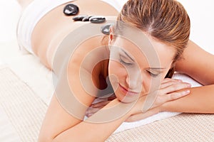 Woman with closed eyes receiving spa therapy
