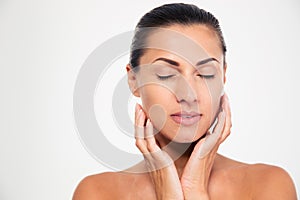 Woman with closed eyes touching her face