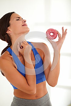 Woman with closed eyes wishing for sugary food