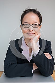 Woman with closed laptop