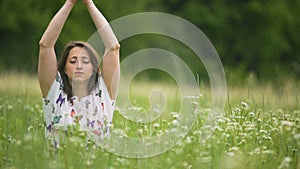 Woman closely connected with nature makes namaste hand sign, feeling oneness