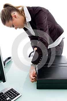 Woman closing the briefcase