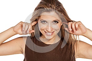 Woman closing ears