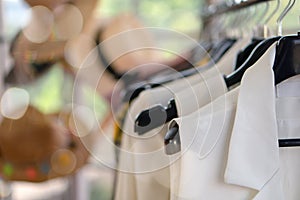 Woman cloth hanging on rack to show at fashion retail store