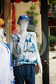 Woman clothes model in front of the clothes shop