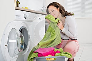 Woman With Clothes Near The Washer