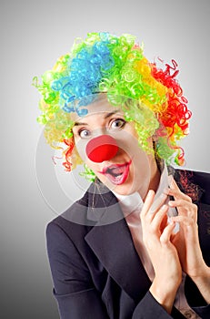 Woman clown in business suit