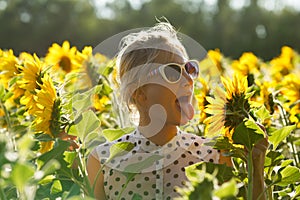 Woman clowns in the sunflowers