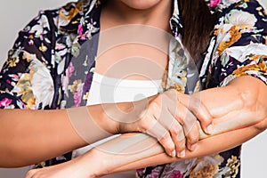 Woman clutching the arm