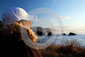 Woman at coast overlooking ocean