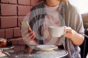 Woman during a coffee break savoring a moment of her busy day. Urban living, city life