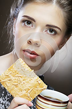 Woman with coffee and cookies