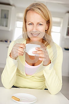 Woman with coffee at home