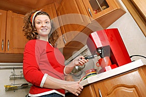 Woman with coffee machine