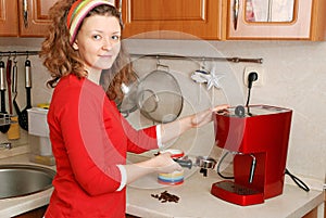 Woman with coffee machine