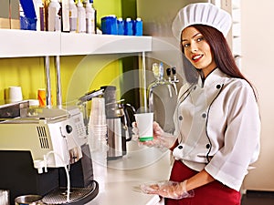 Woman with coffee machine.