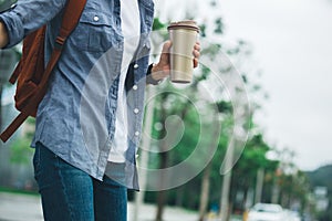 Woman with coffee thermo cup