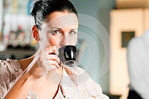 Woman in a coffeeshop photo