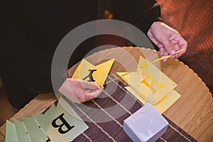 A woman collects congratulatory letters for decoration for her birthday photo