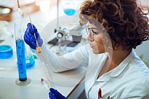 Woman collects forensic DNA sample stick