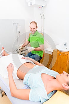 Woman at colon therapy with alternative practitioner photo