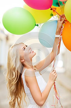 Woman with colorful balloons