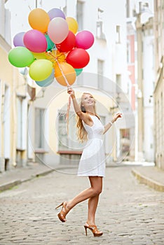 Woman with colorful balloons