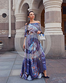 Woman in colorful blue dress