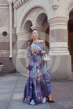 Woman in colorful blue dress