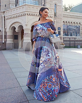 Woman in colorful blue dress