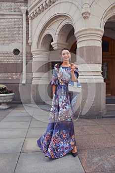 Woman in colorful blue dress