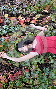 A woman with colorful leaves