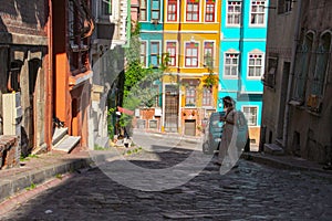 Woman and colorful old buildings in Balat in Istanbul