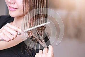 Woman with a comb in her hand on dressing room.