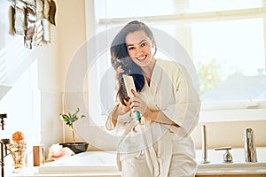 Woman is combing hair