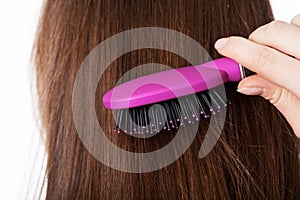 Woman combing hair