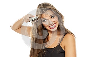 Woman combing her hair