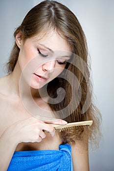 Woman combing her hair